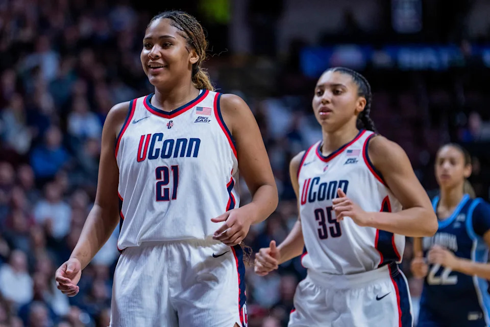 UNCASVILLE, CONNECTICUT - MARCH 09: Sarah Strong #21 and Azzi Fudd #35 of the Connecticut Huskies play against the Villanova Wildcats in the first half of the championship game of the Big East Women’s Basketball Tournament at Mohegan Sun on March 09, 2026 in Uncasville, Connecticut. (Photo by Joe Buglewicz/Getty Images)