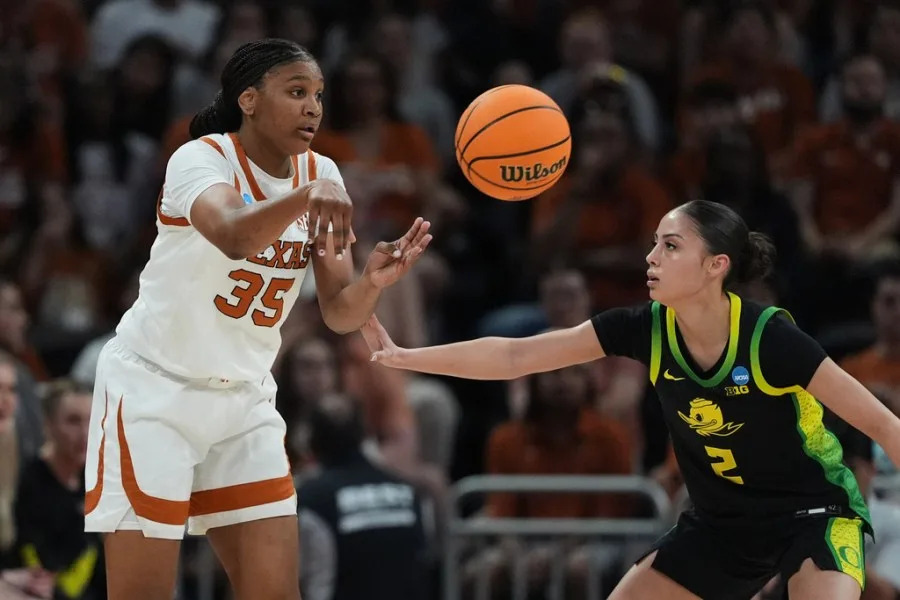 Texas forward Madison Booker (35) moves the ball past Oregon guard Katie Fiso (2) during the first half in the second round of the NCAA college basketball tournament, Sunday, March 22, 2026, in Austin, Texas. (AP Photo/Eric Gay)