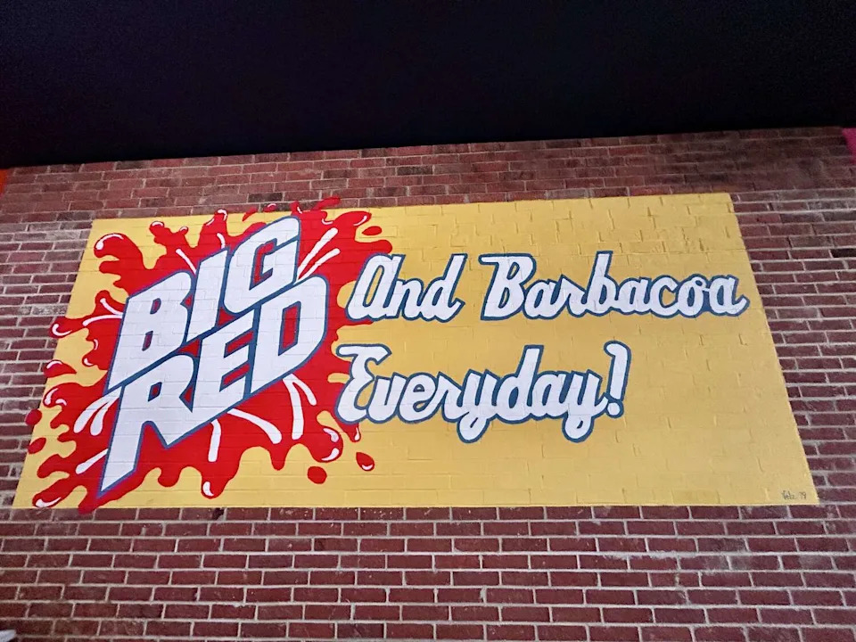 A mural pays tribute to the iconic Big Red and barbacoa pairing at Tommy's Restaurant. (Polly Anna Rocha/MySA)