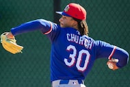 Texas Rangers pitcher Marc Church throws in the bullpen during a spring training workout at...