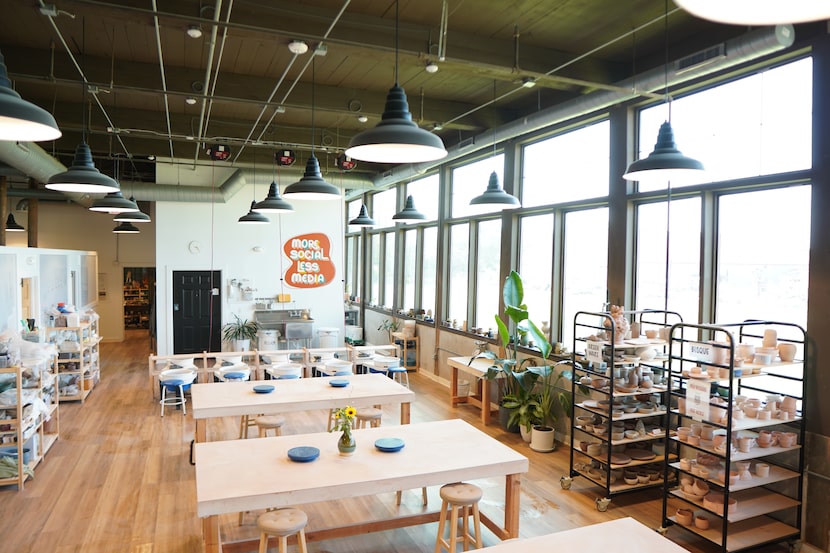 “More social, less media,” suggests the back wall at Glaze. The studio provides an...