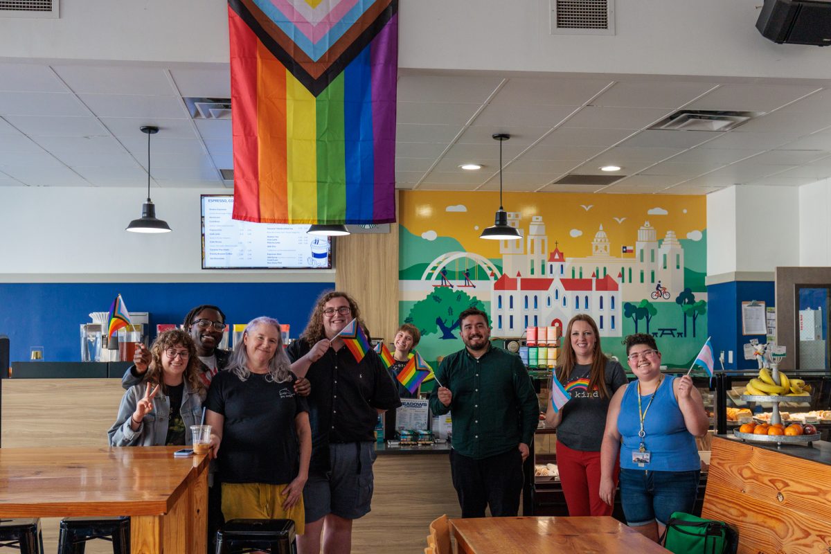 After a gathering at the St. Edward's University Seal, members of the Trans Wellness Organization and PRIDE gathered at Meadows Coffeehouse alongside faculty members Lionel Lopez, Alexandra Barron and Natalie Beck Aguilera. The Pride flag currently at the coffee shop was reinstalled on March 4, 2024 and student leaders from TWO and PRIDE have since organized annual celebrations to remember the protests and what brought the community together.