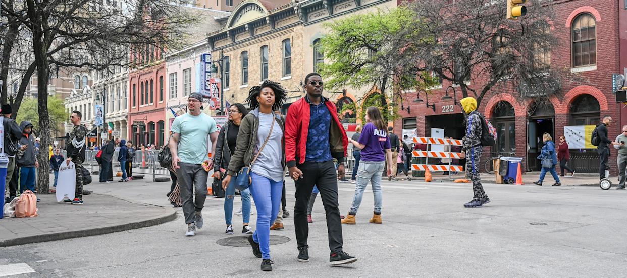 People crowd Sixth Street in Austin, Texas, March 15, 2019.