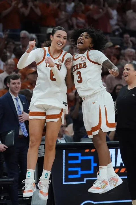 Texas guard Sarah Graves (6) and guard Rori Harmon (3) celebrate during the second half in the first round of the NCAA college basketball tournament game against Missouri State, Friday, March 20, 2026. (AP Photo/Eric Gay)