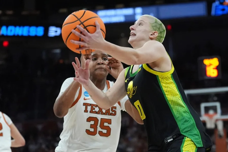 Oregon guard Astera Tuhina (0) drives against Texas forward Madison Booker (35) during the first half in the second round of the NCAA college basketball tournament, Sunday, March 22, 2026, in Austin, Texas. (AP Photo/Eric Gay)