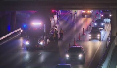 Semi-truck stuck under 11th Street Bridge in Downtown Austin