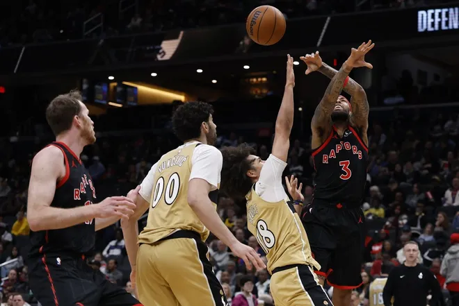 Feb 28, 2026; Washington, District of Columbia, USA; Toronto Raptors forward Brandon Ingram (3) is fouled while shooting by Washington Wizards forward Kyshawn George (18) in the second half at Capital One Arena.