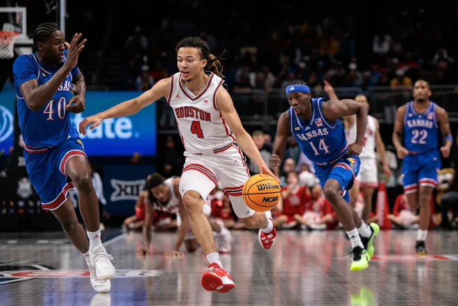 Houston Cougars guard Kingston Flemings drives to the basket during the 2026 Big 12 Conference Tournament Championship at T-Mobile Center.
