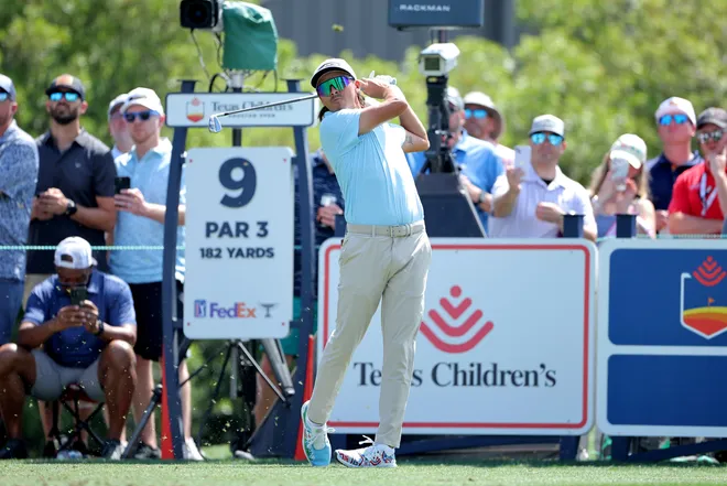 Rickie Fowler hits a tee shot on the ninth hole during the second round of the Texas Children's Houston Open golf tournament.