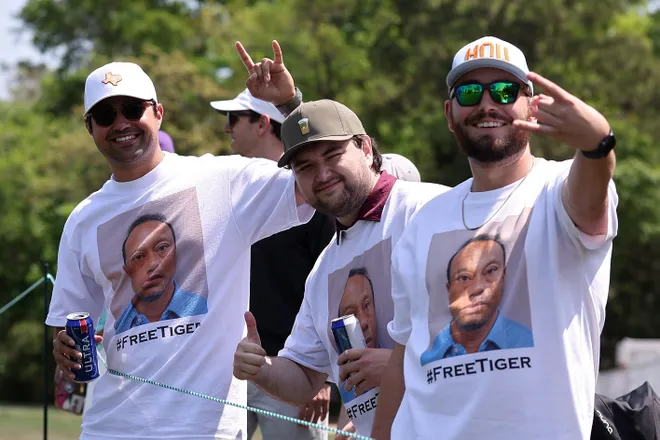 Fans pose for photos while wearing shirts in support of Tiger Woods during the third round of the Texas Children's Houston Open 2026 at Memorial Park Golf Course on March 28, 2026 in Houston, Texas.
