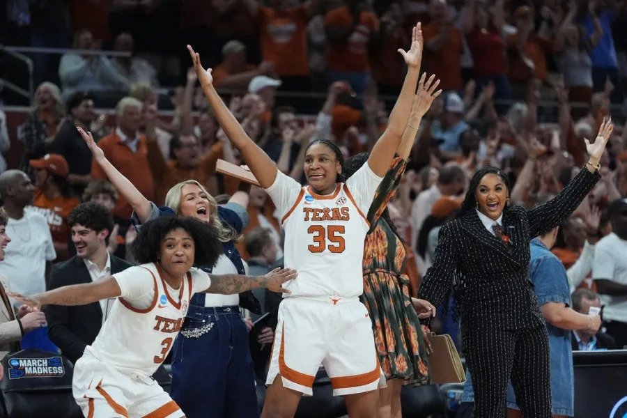 Texas guard Rori Harmon (3), forward Madison Booker (35) and the bench celebrate their win over Oregon in the second round of the NCAA college basketball tournament, Sunday, March 22, 2026, in Austin, Texas. (AP Photo/Eric Gay)