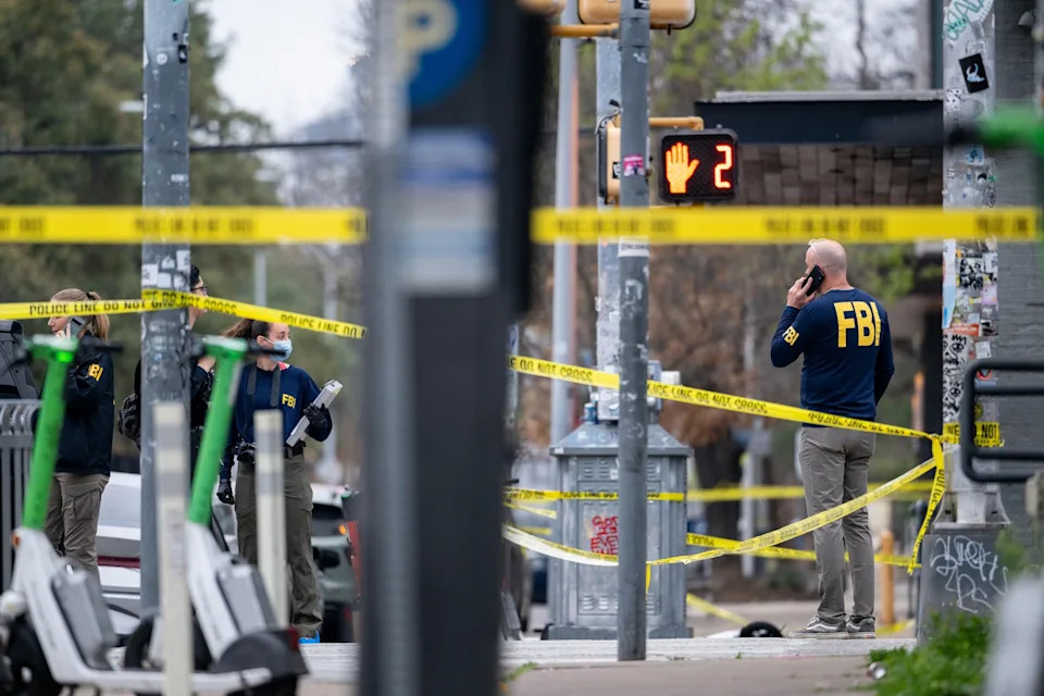 Brandon Bell/Getty Images - PHOTO: Members of the FBI perform an investigation near Buford's bar in Austin, Texas, March 01, 2026, after a mass shooting left three people, including the alleged gunman, dead and 14 others injured.