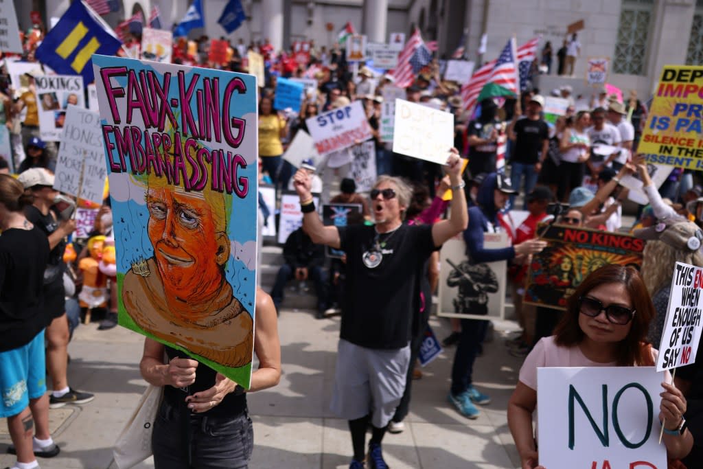 Protesters holding signs and chanting at the No Kings demonstration in Los Angeles. Toby Canham for CA Post