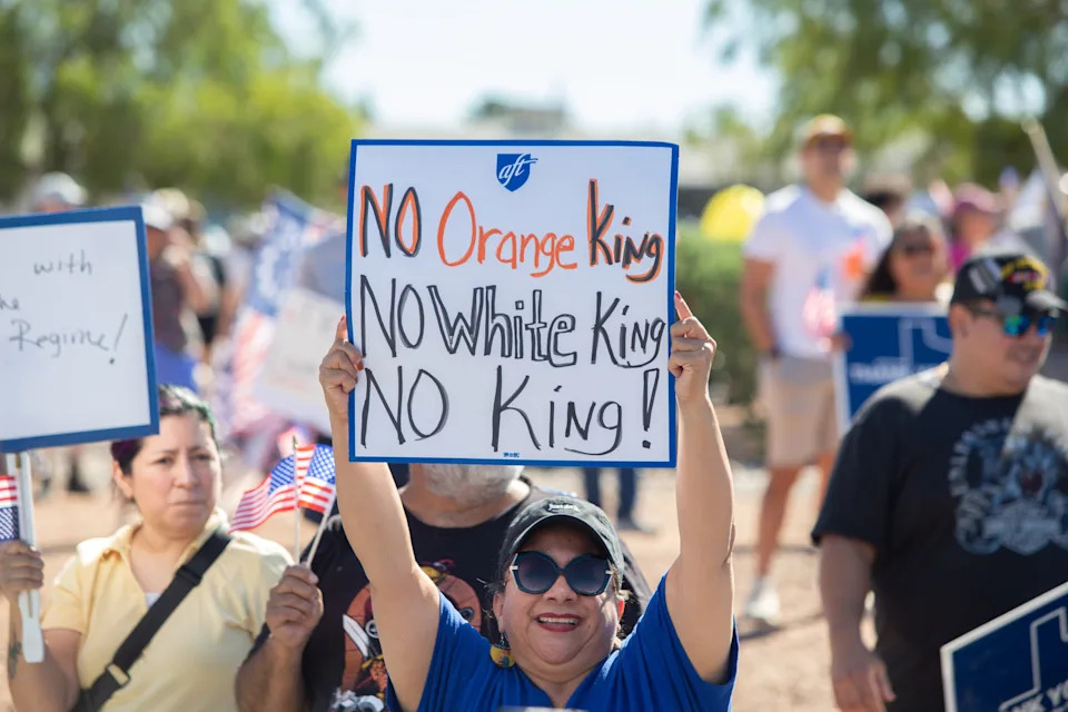A woman holds up a sign saying there are no kings during the El Paso 'No Kings' protest on Oct. 18, 2025.