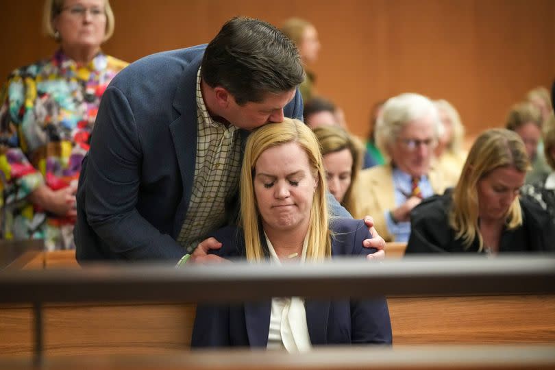 AUSTIN, TEXAS - MARCH 4: Camp Mystic Director Mary Liz Eastland is comforted at a hearing about a temporary injunction at the Travis County Courthouse in Austin on Wednesday, March 4, 2026. Will and CiCi Steward of Austin, whose 8-year-old daughter, Cile Steward, was swept away in the July 4, 2025, flash flood at Camp Mystic and has not been found, are seeking to prevent the camp from reopening this summer and to halt repairs and construction until their lawsuit against the camp and other parties goes to trial. The Stewards say they want to preserve potential evidence related to their daughter's death. (Jay Janner/The Austin American-Statesman via Getty Images)