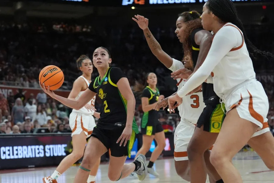 Oregon guard Katie Fiso (2) drives against Texas during the first half in the second round of the NCAA college basketball tournament, Sunday, March 22, 2026, in Austin, Texas. (AP Photo/Eric Gay)