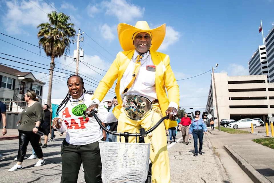 In this 2023 file photo, Ronnie "Pointy Boots" Mathis rides his bicycle in the Martin Luther King Jr. Day march in downtown Corpus Christi.