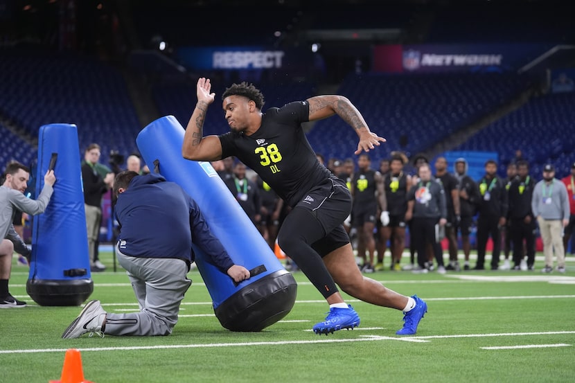 Auburn defensive lineman Keldric Faulk (38) runs a drill at the NFL football scouting...