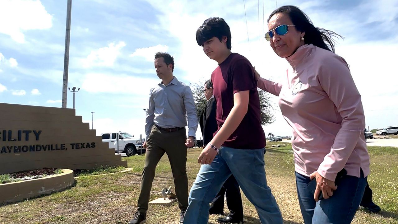 A U.S. Border Patrol agent walk up to a new section of the border wall before the arrival of Acting Homeland Secretary Chad Wolf Thursday, Oct. 29, 2020, in McAllen, Texas. (Joel Martinez/The Monitor via AP)