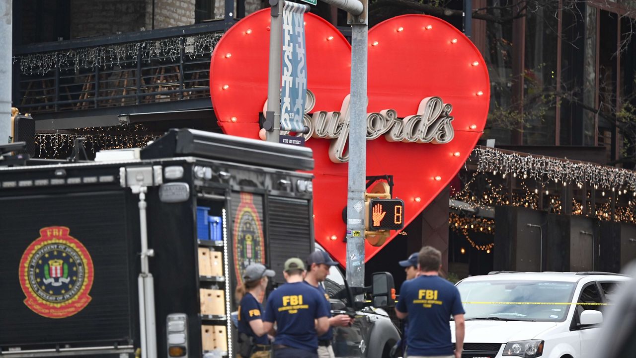 The Austin Police Department and the FBI investigate a shooting at Buford's on 6th Street on Sunday, March 1, 2026, in Austin, Texas. (AP Photo/Jack Myer)
