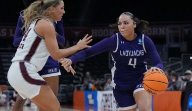 Stephen F. Austin guard Ashlyn Traylor-Walker (4) drives around Missouri State guard Kaemyn Bekemeier (24) during the second half in a First Four college basketball game in the NCAA Tournament, Wednesday, March 18, 20206, in Austin, Texas. (AP Photo/Eric Gay)