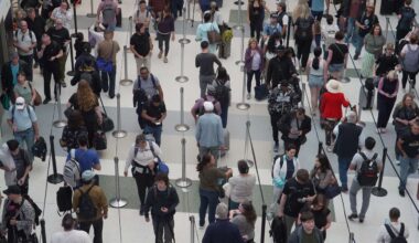 Travelers line up at a TSA checkpoint at George Bush Intercontinental Airport in Houston, Tuesday, March 24, 2026.  (AP Photo/Lekan Oyekanmi)
