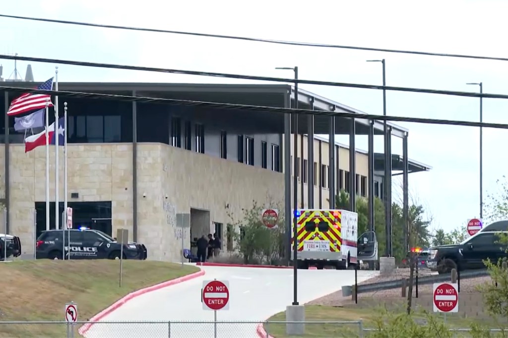 This image taken from video provided by KSAT shows first responders outside after a student shot a teacher at Hill Country College Preparatory High School, Monday, March 30, 2026, in Bulverde, Texas.