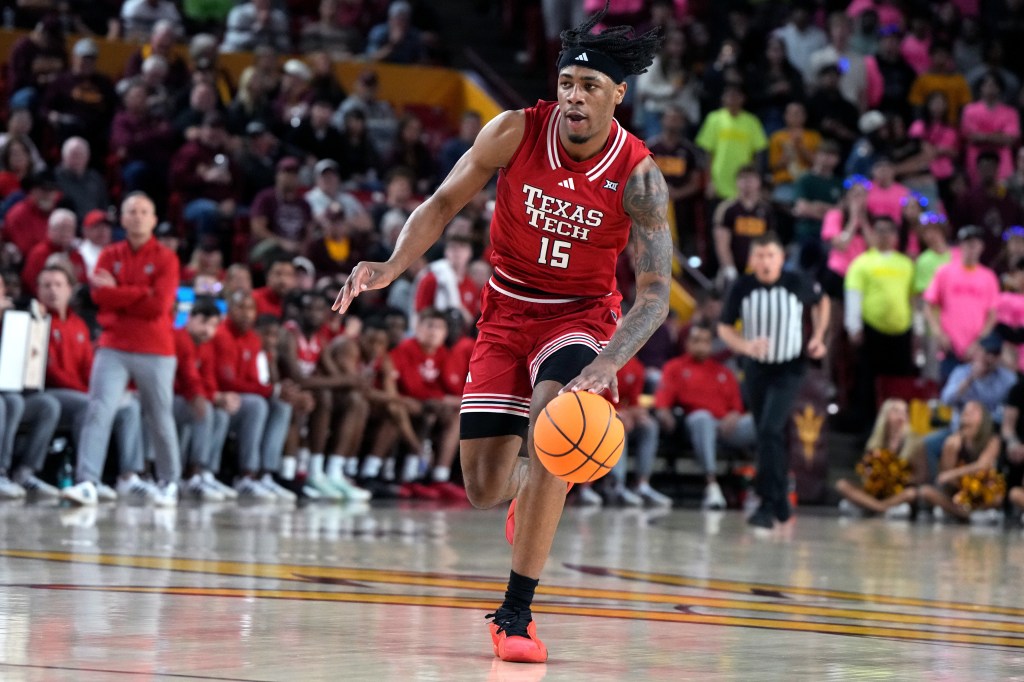 Texas Tech forward JT Toppin drives against Arizona State during the first half of an NCAA college basketball game, Tuesday, Feb. 17, 2026, in Tempe, Ariz. (AP Photo/Rick Scuteri)