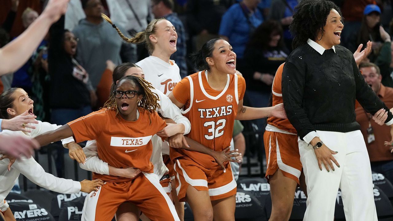 Texas players celebrate as they defeat South Carolina in an NCAA college basketball game in the Players Era tournament in Las Vegas, Thursday, Nov. 27, 2025. (AP Photo/Eric Gay)