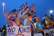 FILE - Dee Cahill of Margate, Fla., holds a "No Kings" sign as she participates in a...