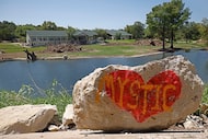 A red heart with “Mystic” sign is seen  by the Guadalupe River, the other side of Camp...