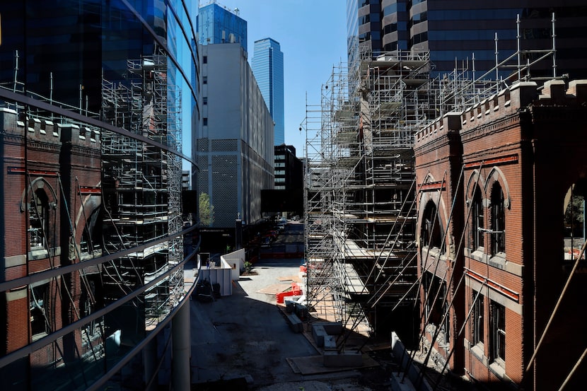 The historic First Baptist Dallas sanctuary under reconstruction (right) in downtown Dallas...