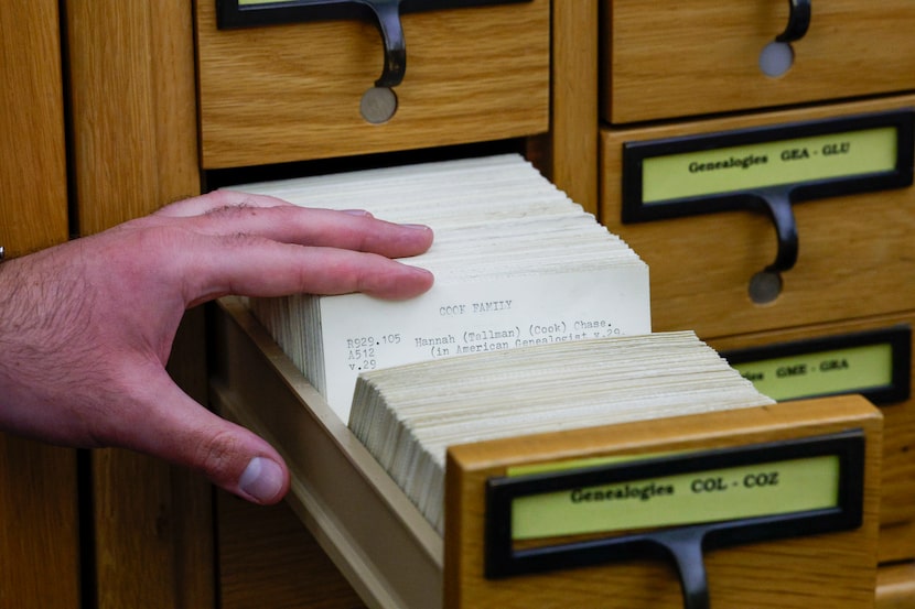 Librarian David Alexander Garza shows a card catalog used for genealogy research in the...