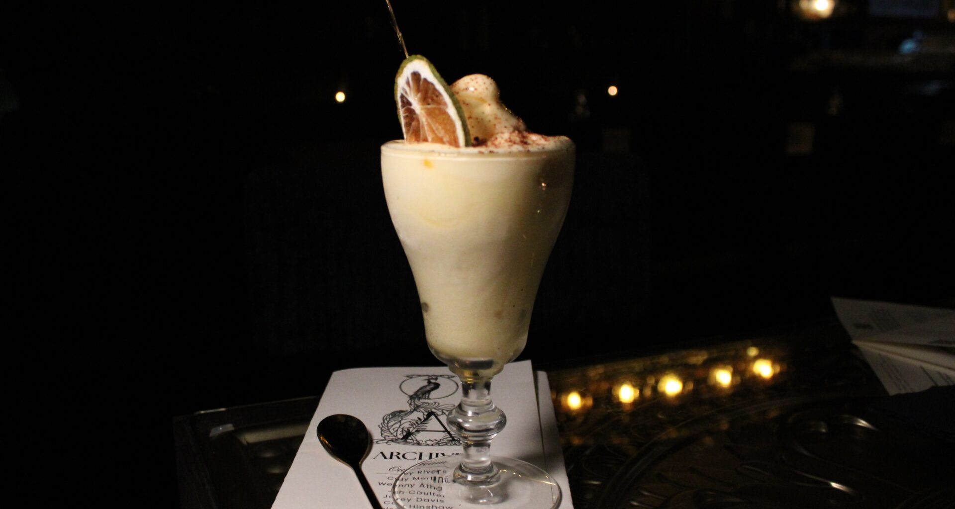 The soft serve margarita from Apothecary in a dainty glass.