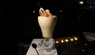 The soft serve margarita from Apothecary in a dainty glass.