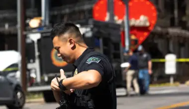 A police officer radios for backup near the scene of a mass shooting at a bar in Austin, Texas, that left two dead and 14 injured on March 1, 2025. (Photo Credit: Reuters)
