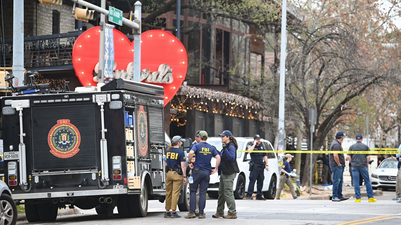 The Austin Police Department and the FBI investigate a shooting at Buford's on 6th Street on Sunday, March 1, 2026, in Austin, Texas. (AP Photo/Jack Myer)