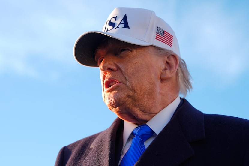 President Donald Trump speaks to reporters before he boards Air Force One, Friday, March 13,...