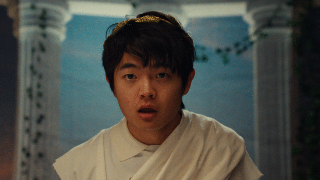 A young person wears a shocked expression in a still image from the film 