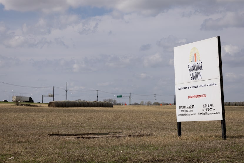 Hay bales sit in a field that will be the future site of a Parkland Clinic on Monday, March...