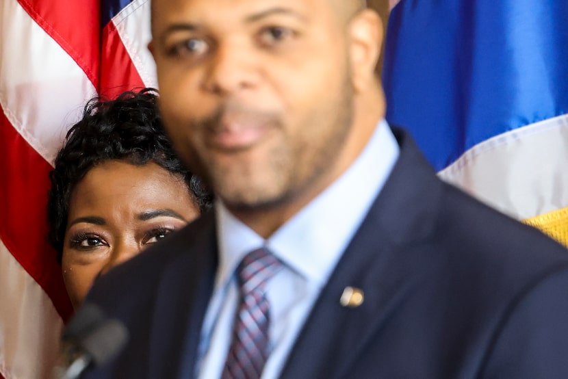 Dallas city manager Kimberly Bizor Tolbert (left) follows as Dallas Mayor Eric Johnson leads...