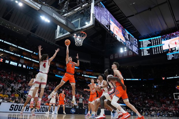 Illinois' Andrej Stojaković (2) shoots over Houston guard Kingston Flemings during the second half in the Sweet 16 of the NCAA Ttournament on Thursday, March 26, 2026, in Houston. (Ashley Landis/AP)
