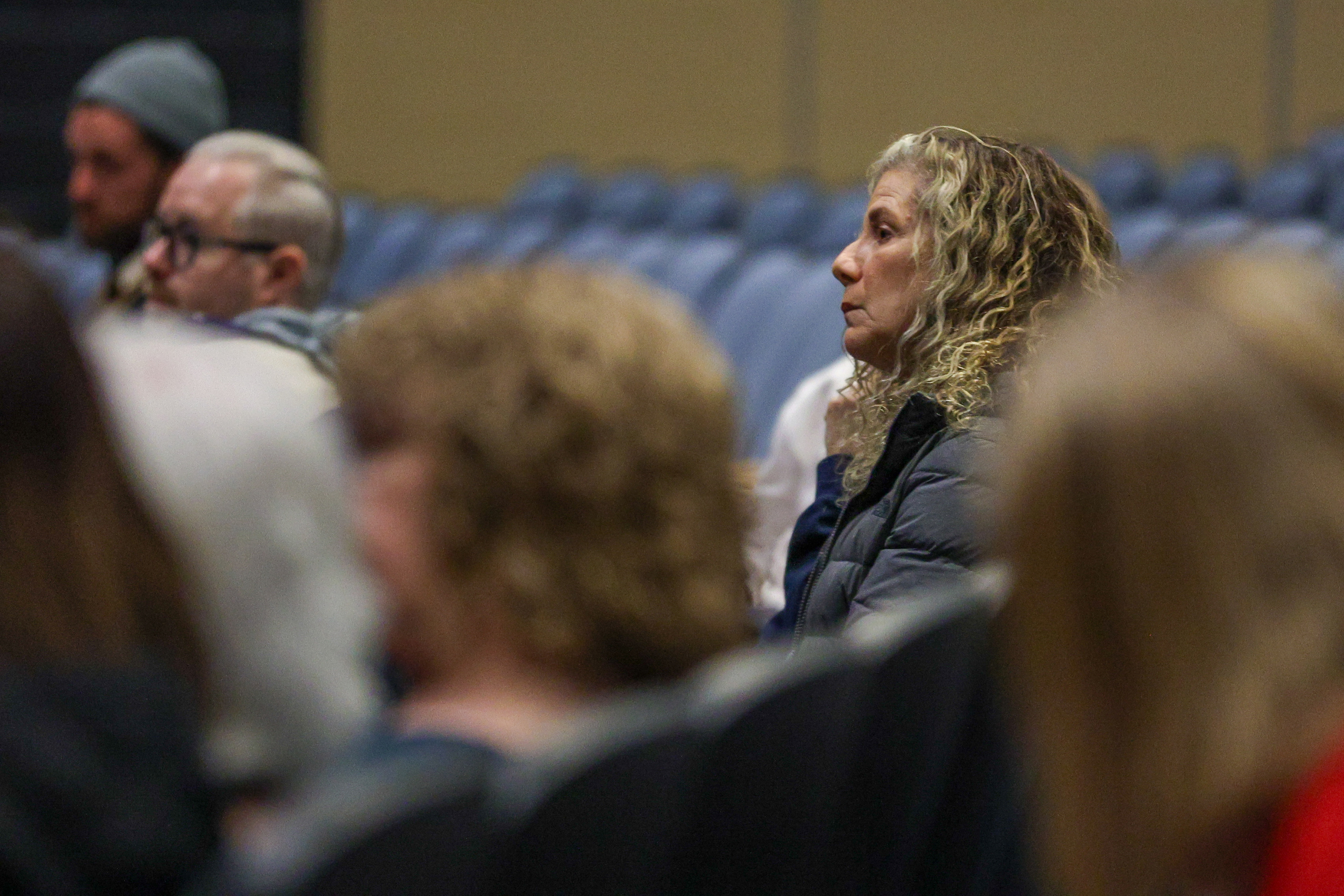 Attendees look on during a special meeting regarding data centers...