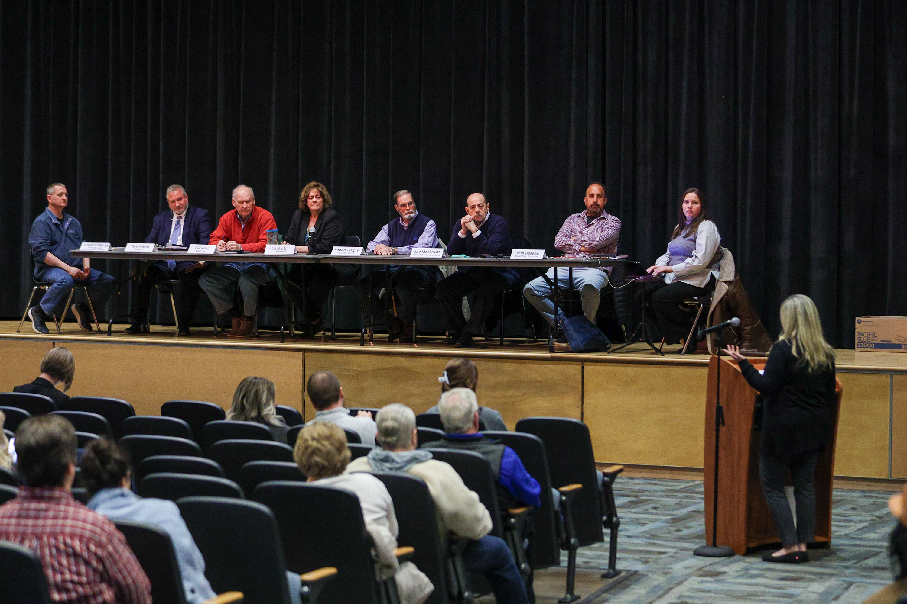 The Dallas Twp. Board of Supervisors look on as Junell...