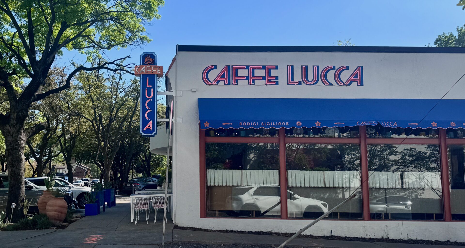 The sign and exterior of Caffe Lucca in Dallas