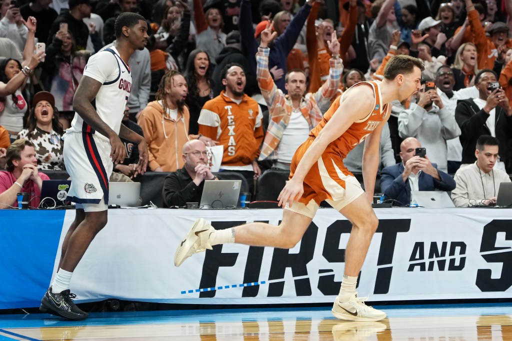 Camden Heide (right) celebrates after hitting a big 3-pointer in the final minute of Texas' 74-68 win over Gonzaga on March 21, 2026 in the second round of the NCAA Tournament.