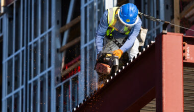 Behind the tarp: A look at the workers behind the Centennial Project