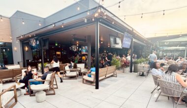 The rooftop at Culinary Dropout with lots of people hanging out and drinking.