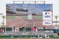 The scoreboard shows the ABS results after Texas Rangers outfielder Leody Taveras challenged...