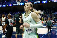 Dallas Wings guard Paige Bueckers (5) jogs off the court after the first half of a WNBA...